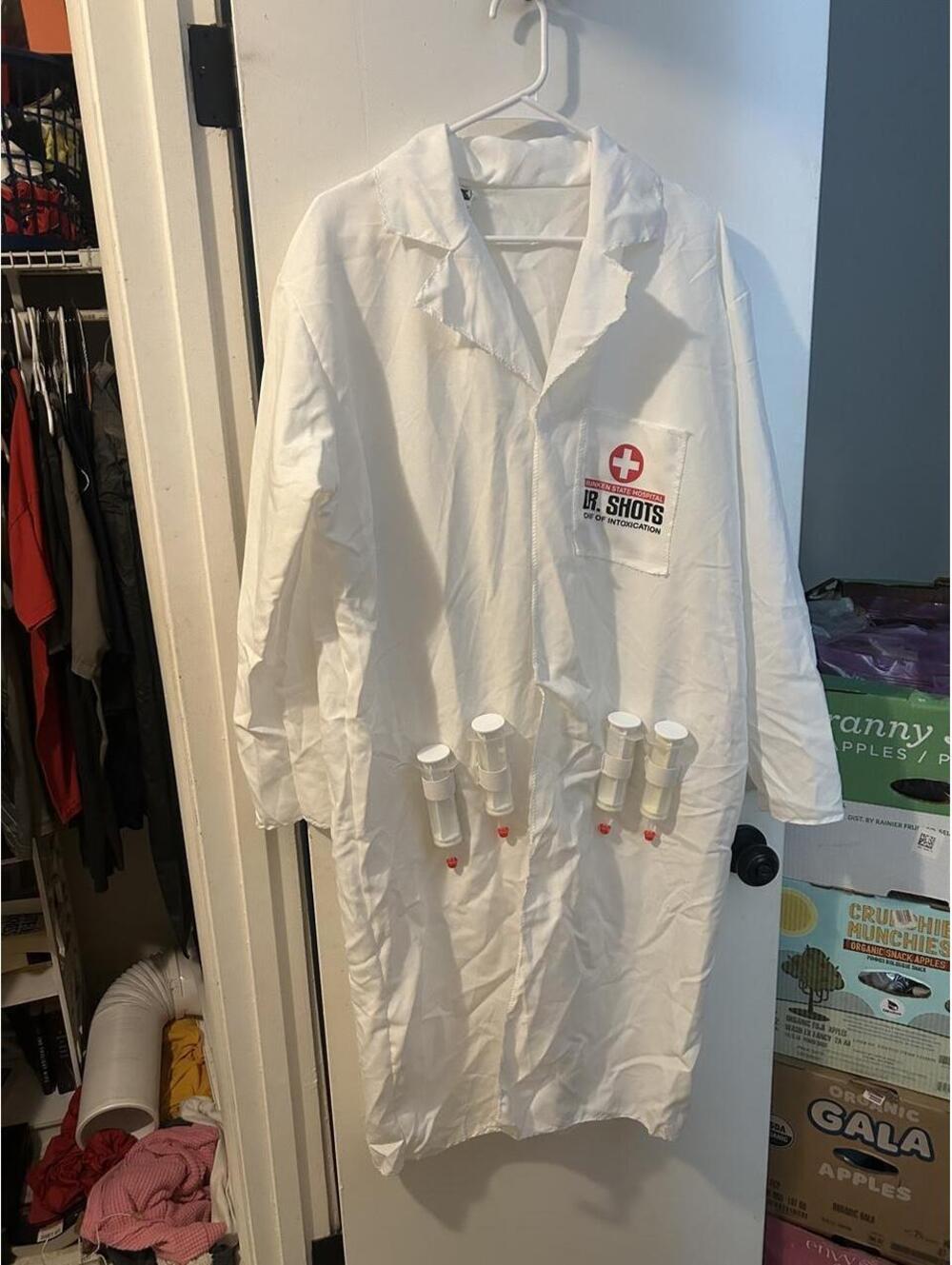 White lab coat costume with pockets and a red cross logo